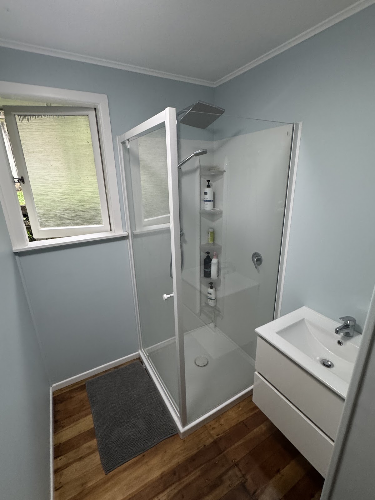 Completed bathroom refit with glass shower and vanity